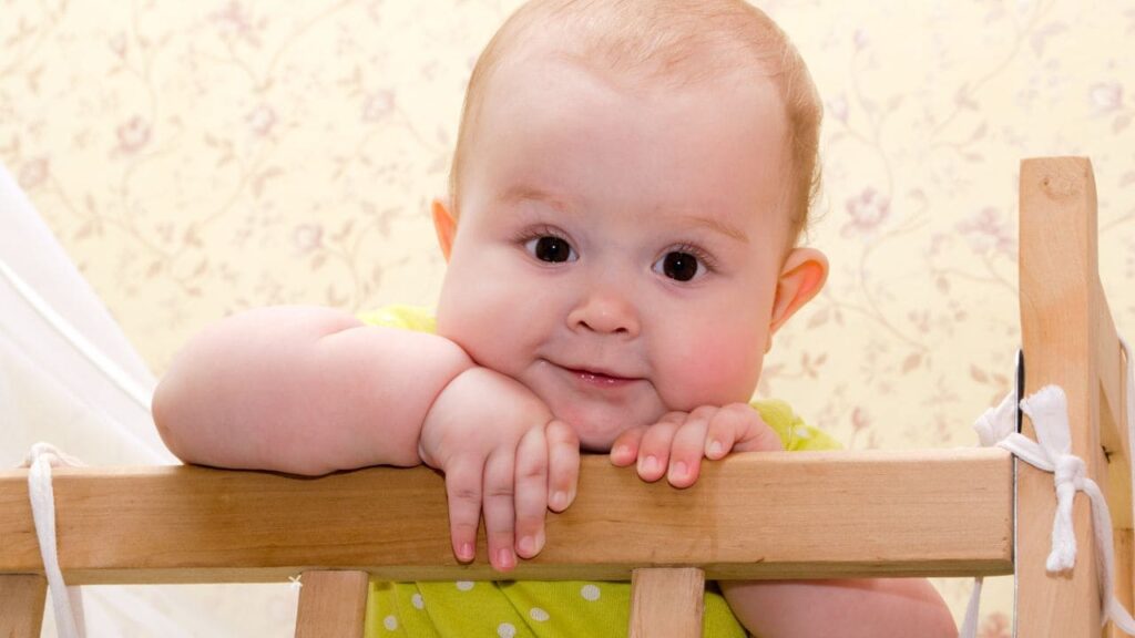 Baby Sitting Up in Crib 3