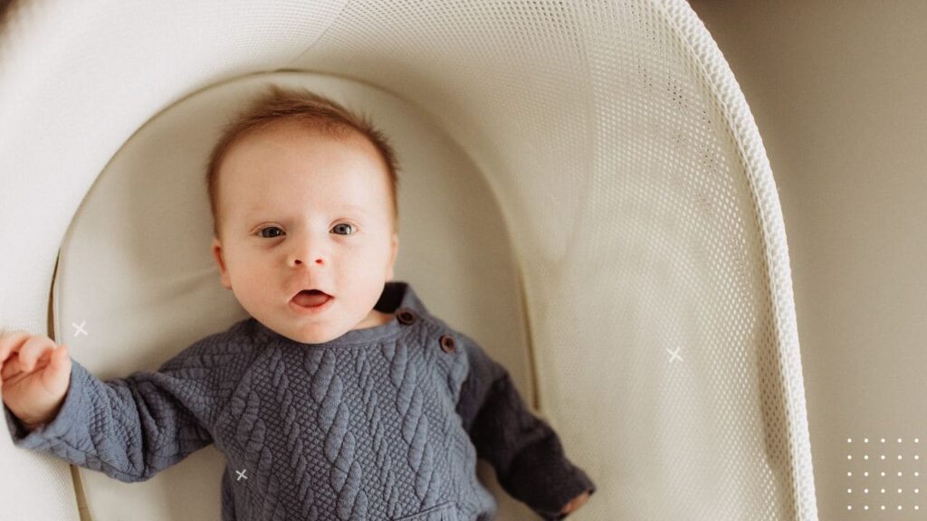 Newborn Rolling to Side in Bassinet 4